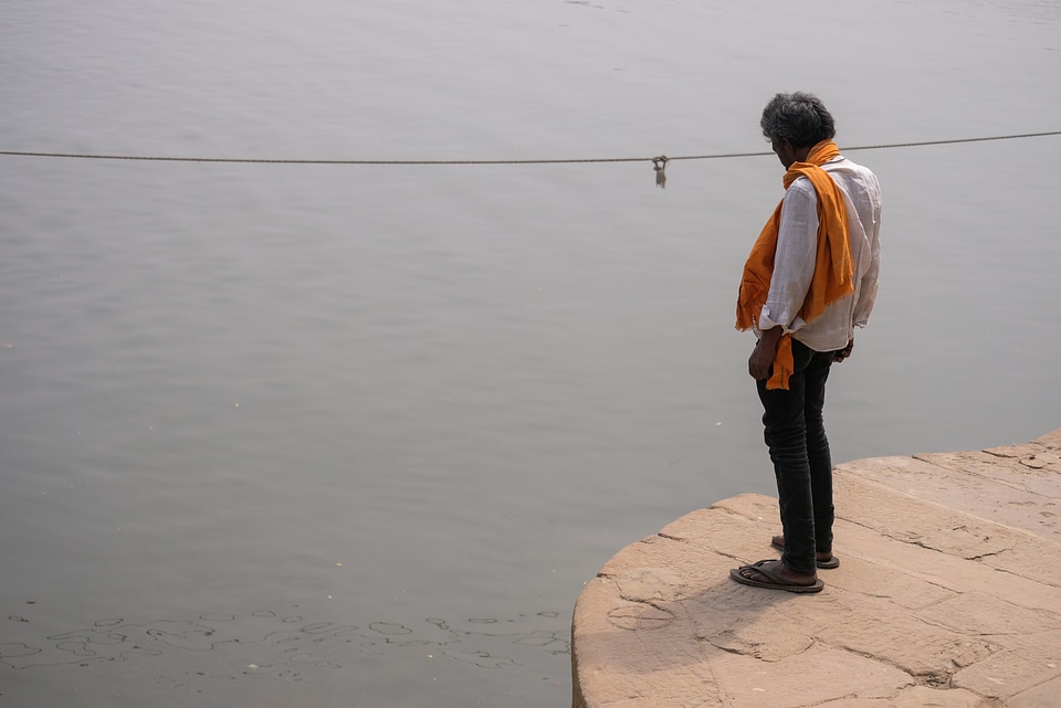 Old Man Standing on Edge