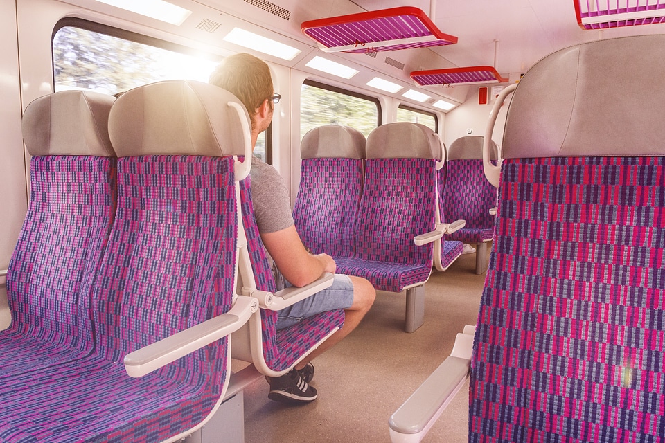 Young man traveling with train photo