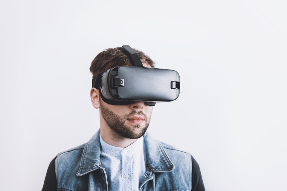 Man wearing virtual reality goggles. photo