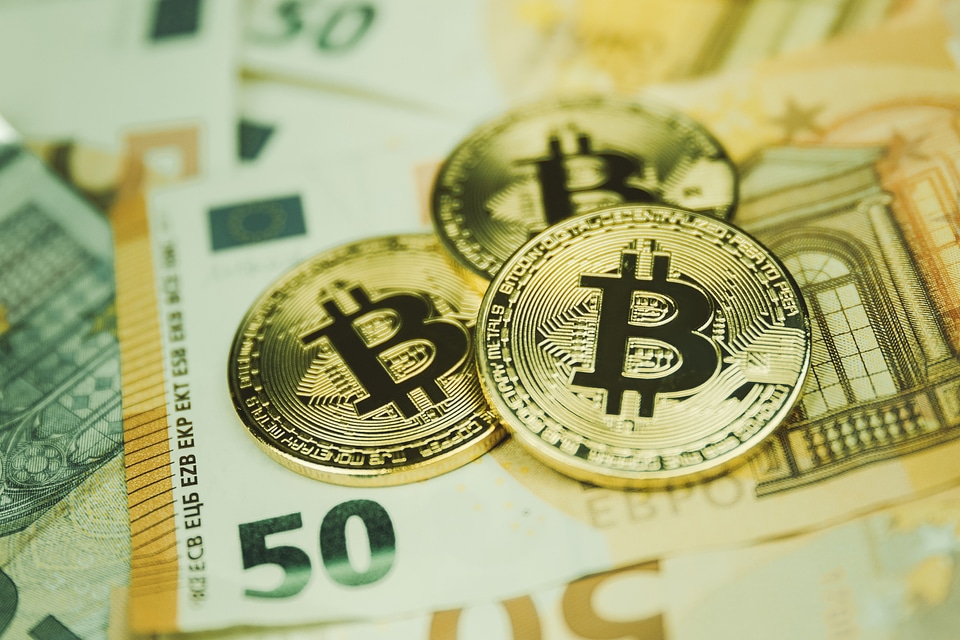 1 Golden bitcoin Euro background. Bitcoin cryptocurrency.