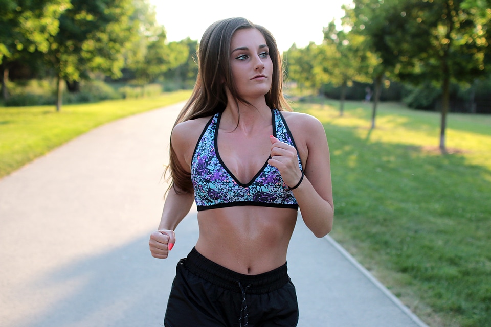 Running woman. Female Runner Jogging during Outdoor Workout in a Park.