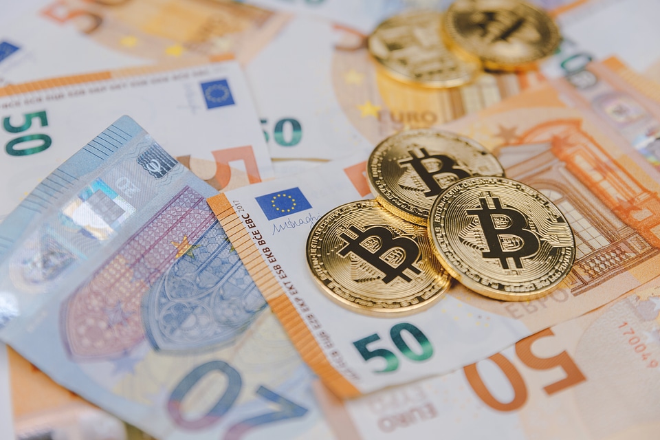 1 Bitcoins and euros, money and currency exchange rate concept