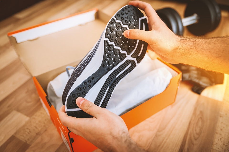 Opening the box of a new pair of shoes