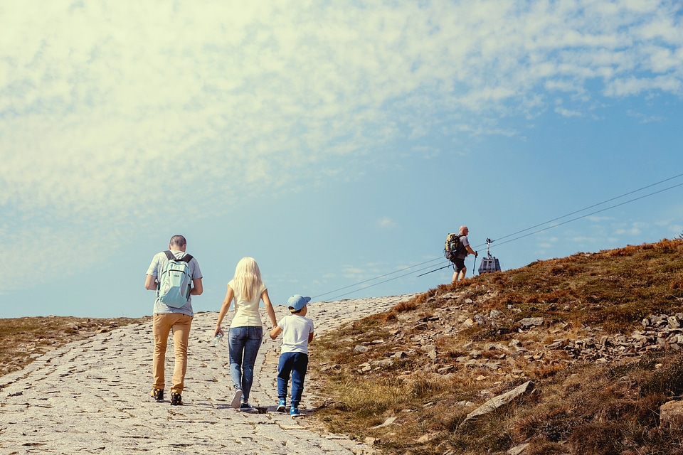 Family of three on their vacation in mountains