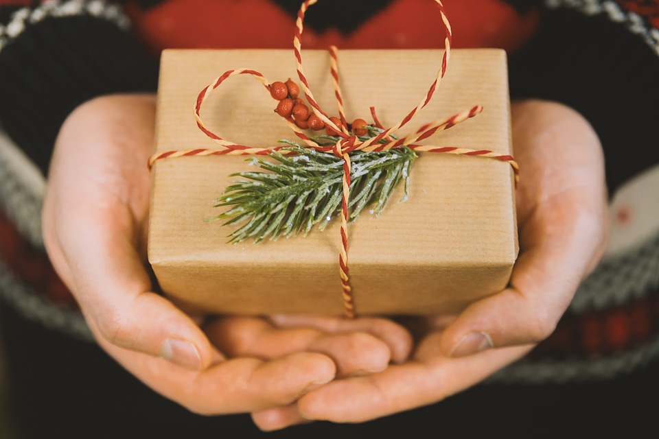 1 Man’s hands hold christmas gift box. Merry Christmas