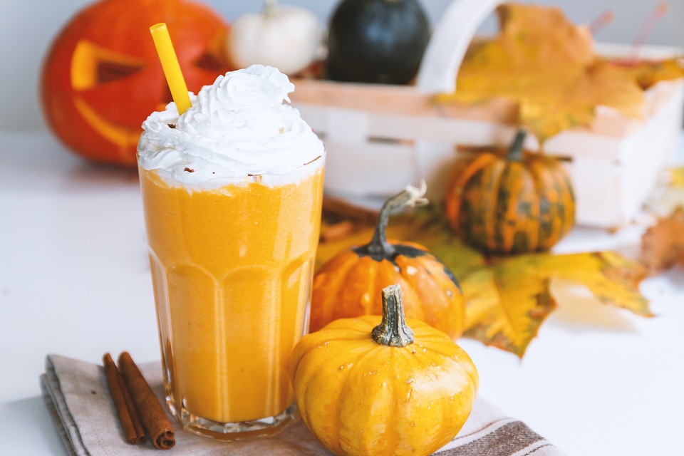 1 Pumpkin smoothie. Small pumpkins and drink on the white background