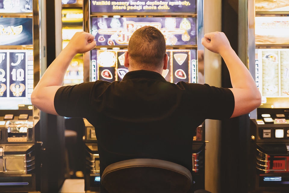 1 Man playing the slot machine at casino