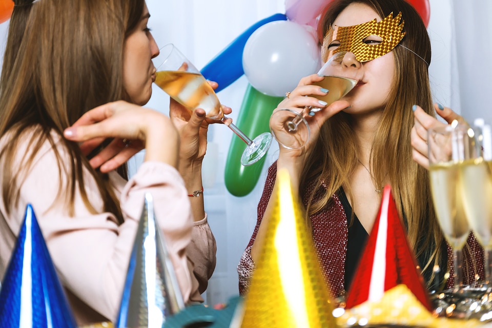 1 Two young girls celebrate. Happy New Year