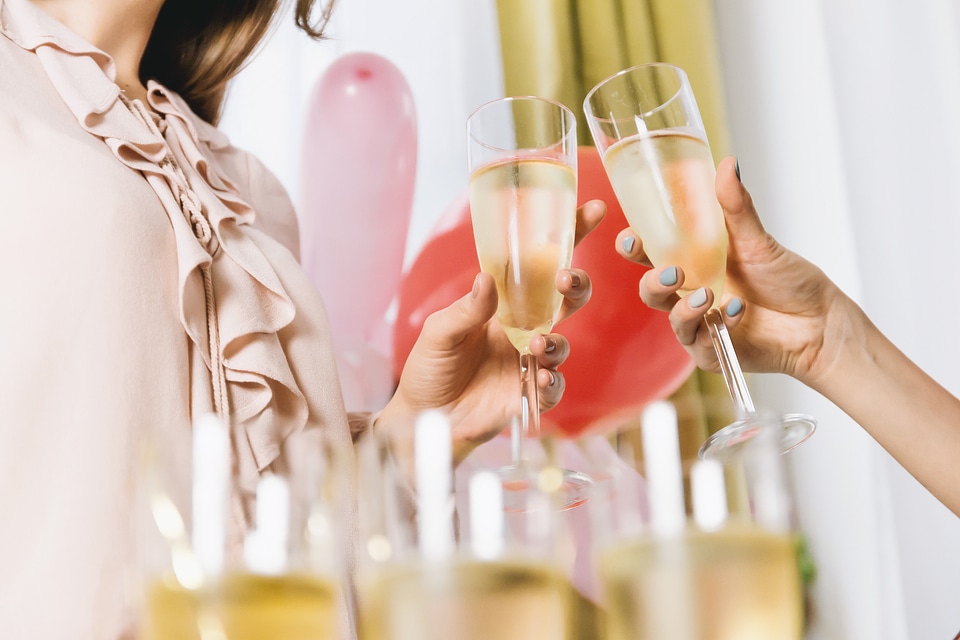 Celebration. People holding glasses of champagne making a toast. Happy New Year!