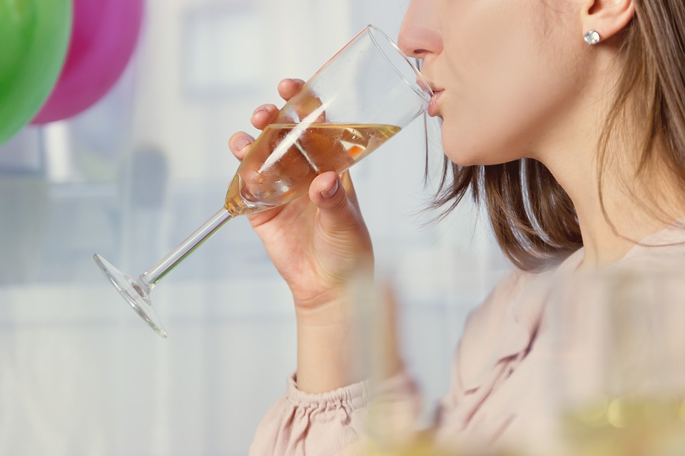 Girl drinking a glass of champagne