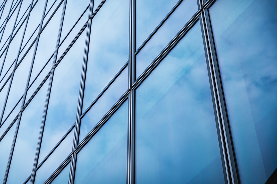 2 Windows of Skyscraper Business Office with blue sky, Corporate building in city.