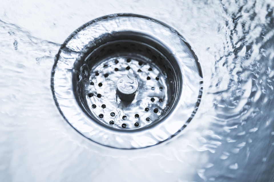 High Angle View Of Water Flowing In Drain