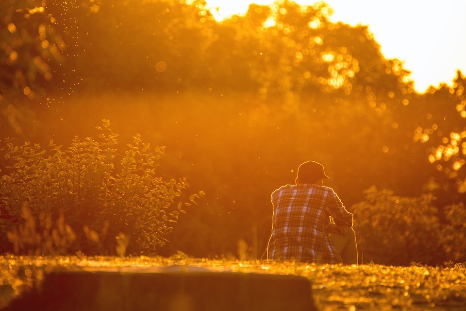 Young man is looking at the sunset