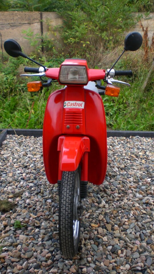 Roller red motor scooter