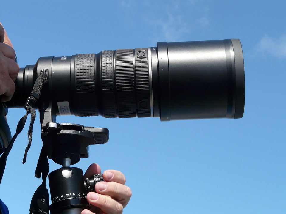 Camera tripod recording photographer