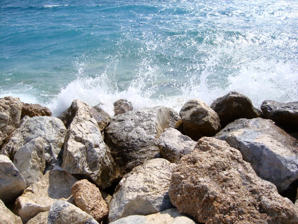 Wave beach rocky shore photo