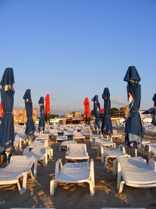 Sun loungers umbrellas photo