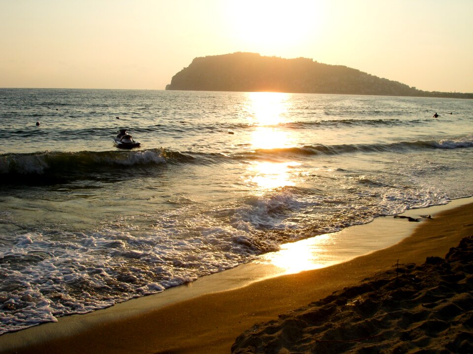 Cliff sea jetski photo