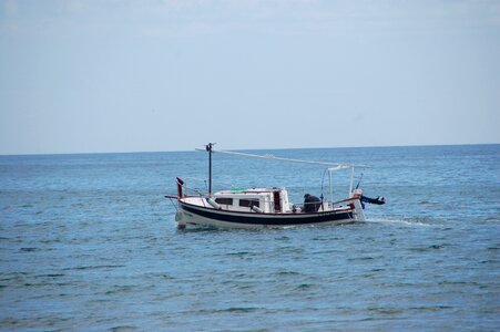 Fisherman boat sea fishing photo