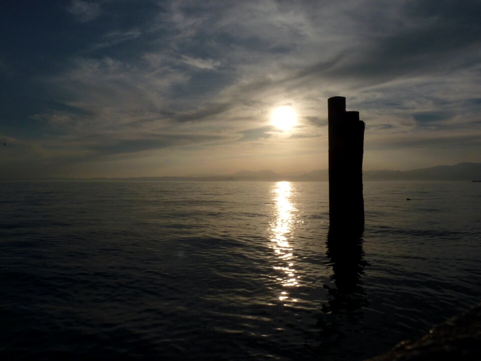 Setting sun water garda