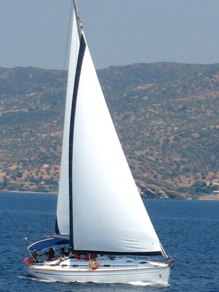 Mediterranean sea boat white sails