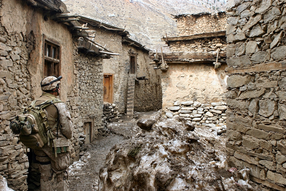 Soldier taliban stone houses photo