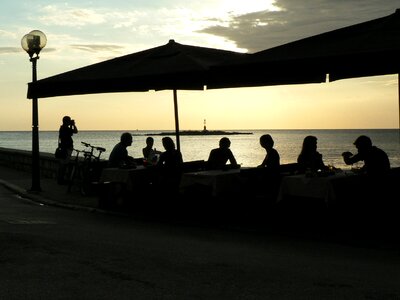 Shadow people sea dinner