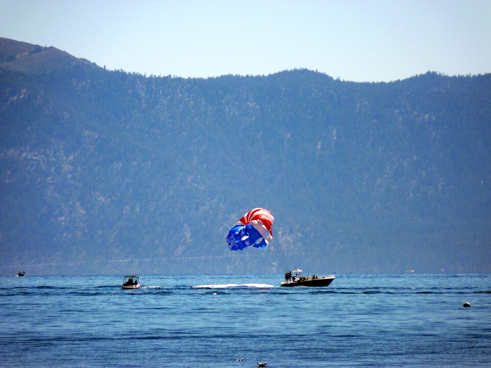 Sandy beach parasailing speed boat