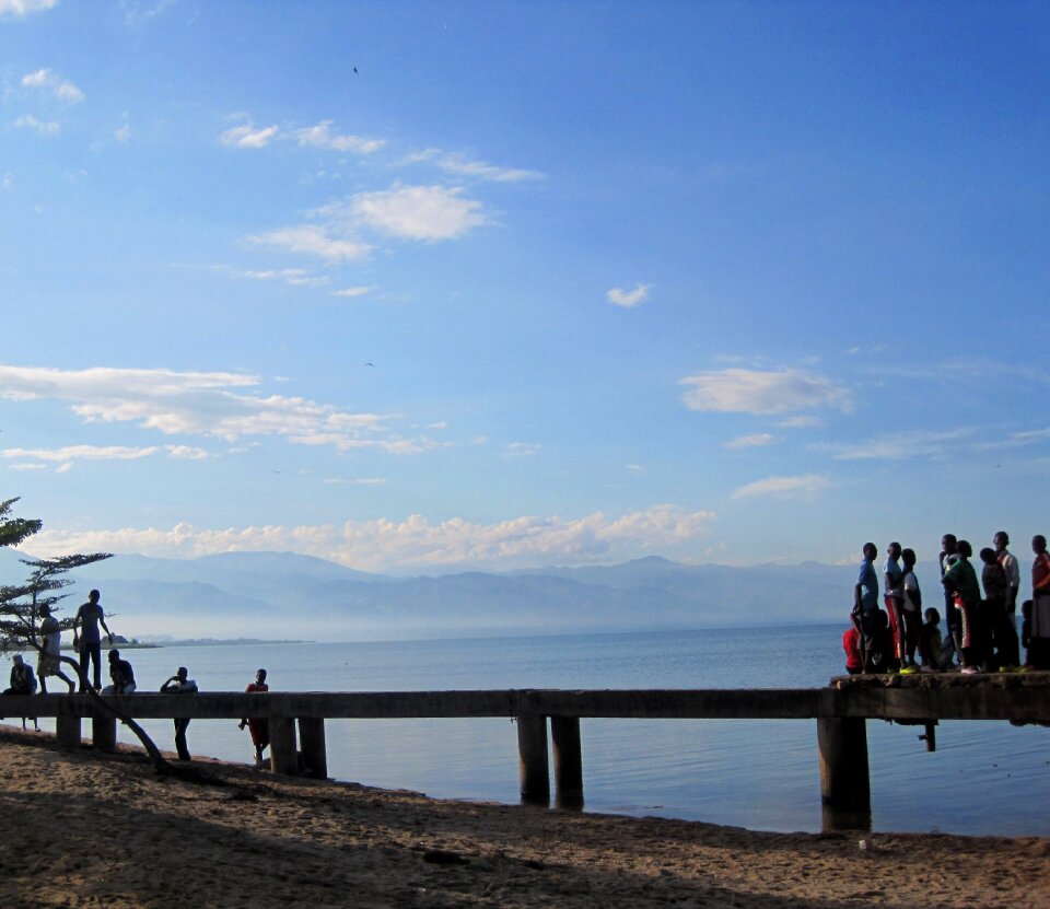 Blue sky jetty blue water