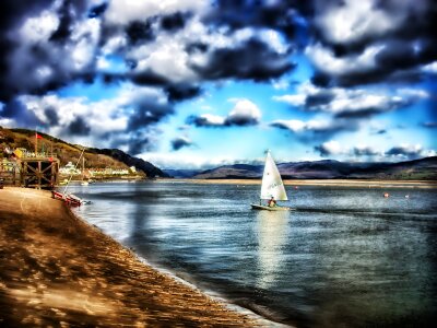 Clouds lake sailboat