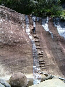 Steep slope rope ladder rock photo