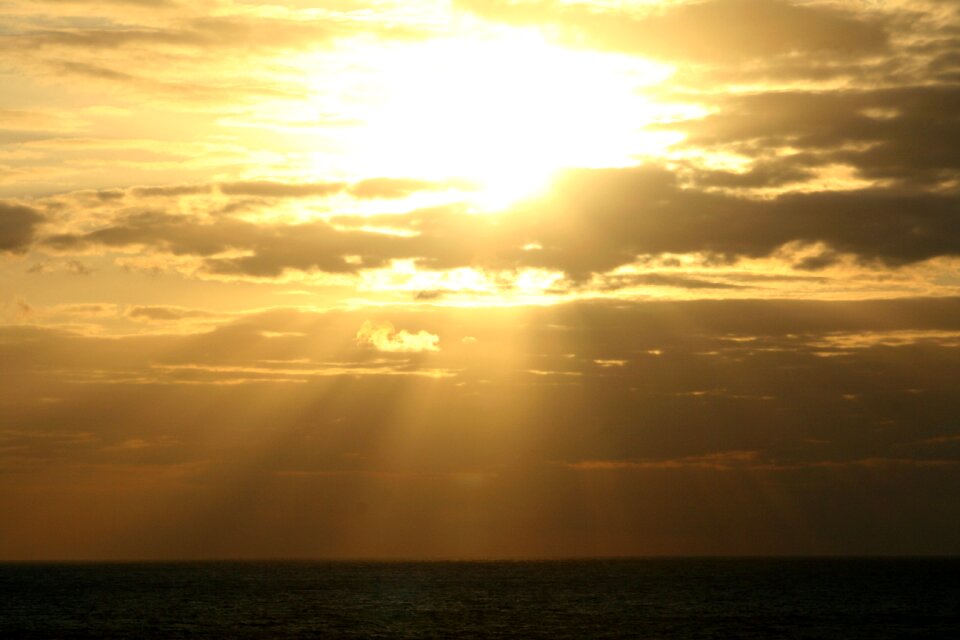 Setting sun sky water
