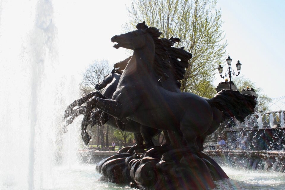 Statue of four wild horses water spraying movement portrayed