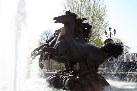Statue of four wild horses water spraying movement portrayed