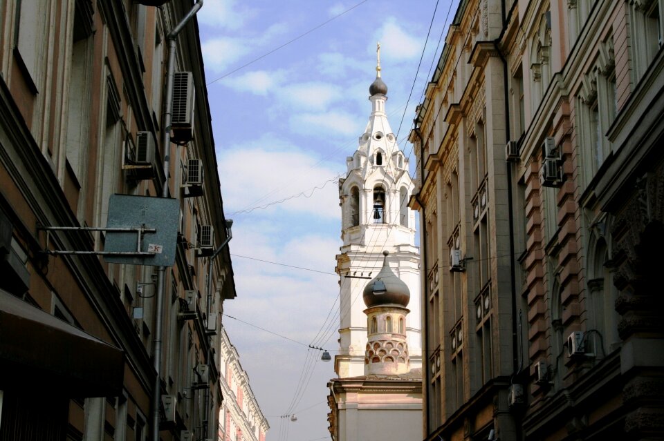 Erect buildings shaded church
