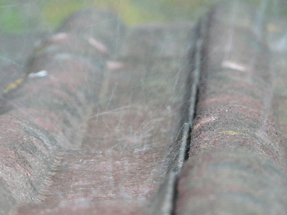 Rain splashes downpour roof