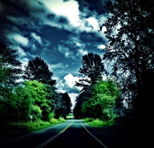 Rural road clouds country
