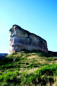 Tall flat topped layered sandstone photo