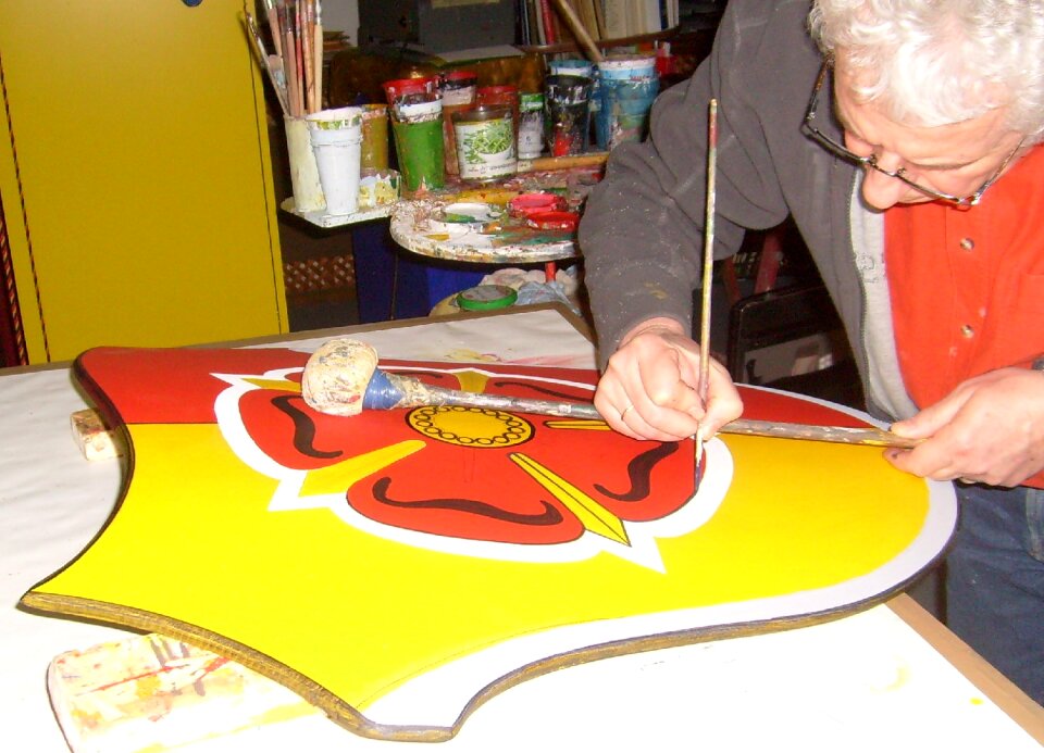 Paint brush lipper coat of arms script painter