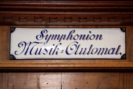Lettering art nouveau font self playing musical instruments