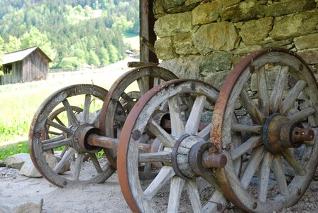 Farmers work wooden wheel