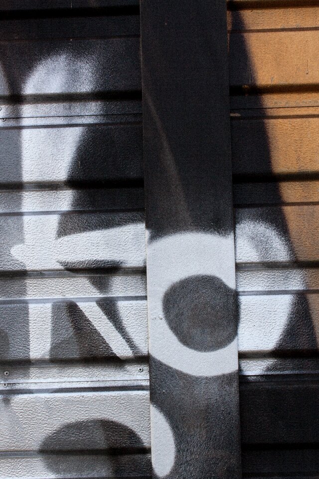 Sheet metal fence city facade