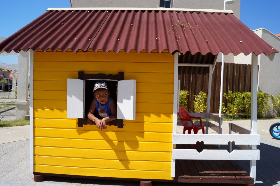 Brown roof white window little child