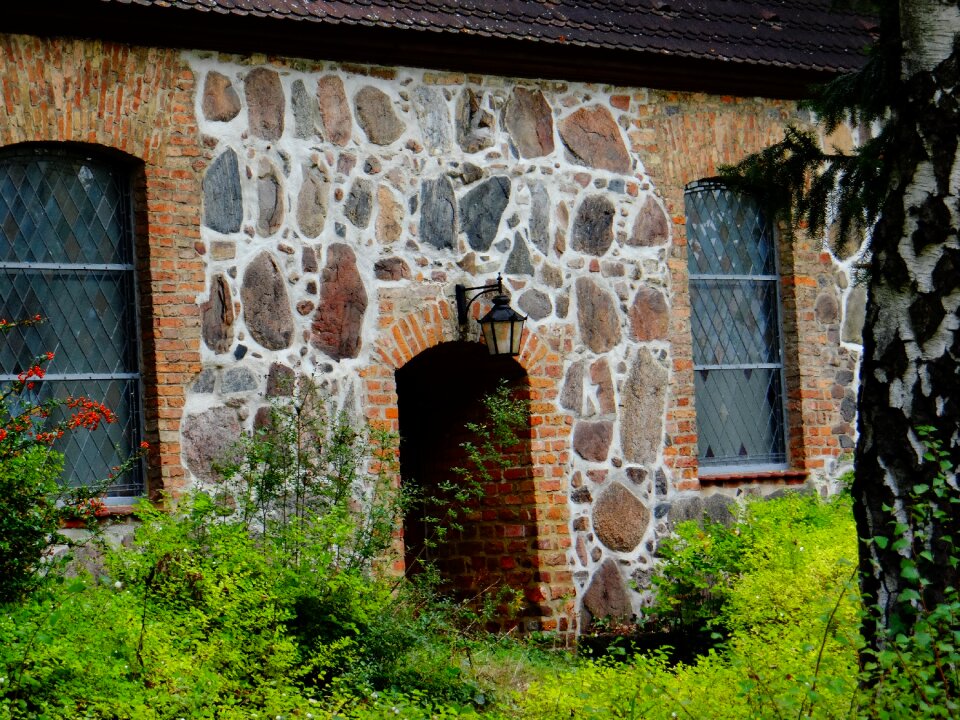 Landscape stone house facade photo