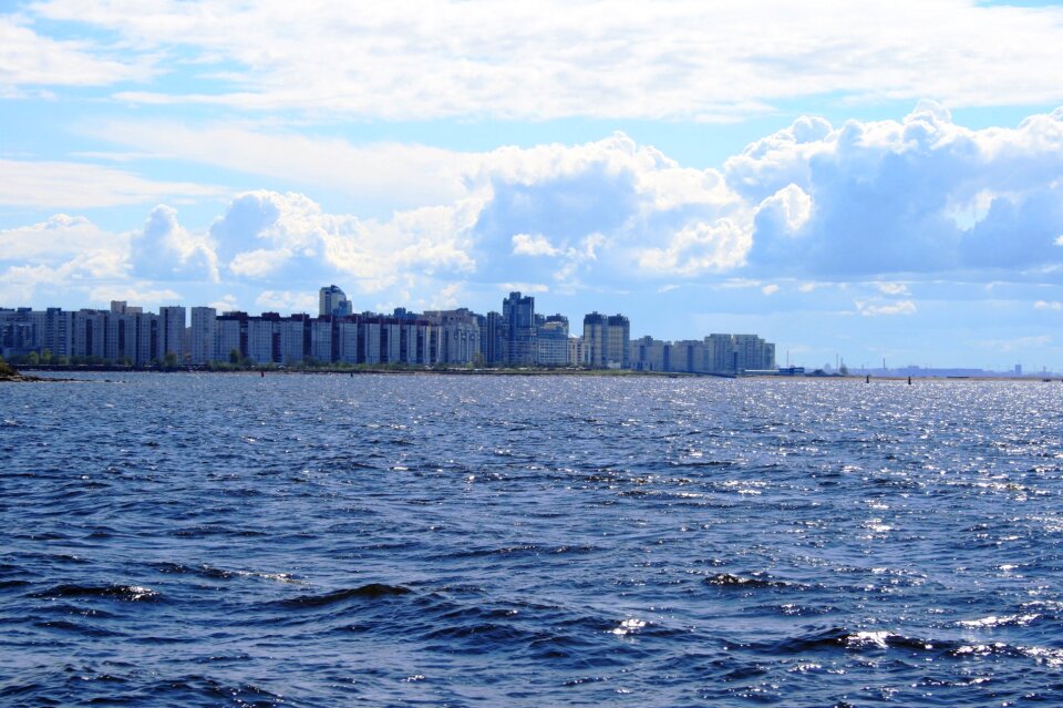 Ocean glistening row of buildings photo