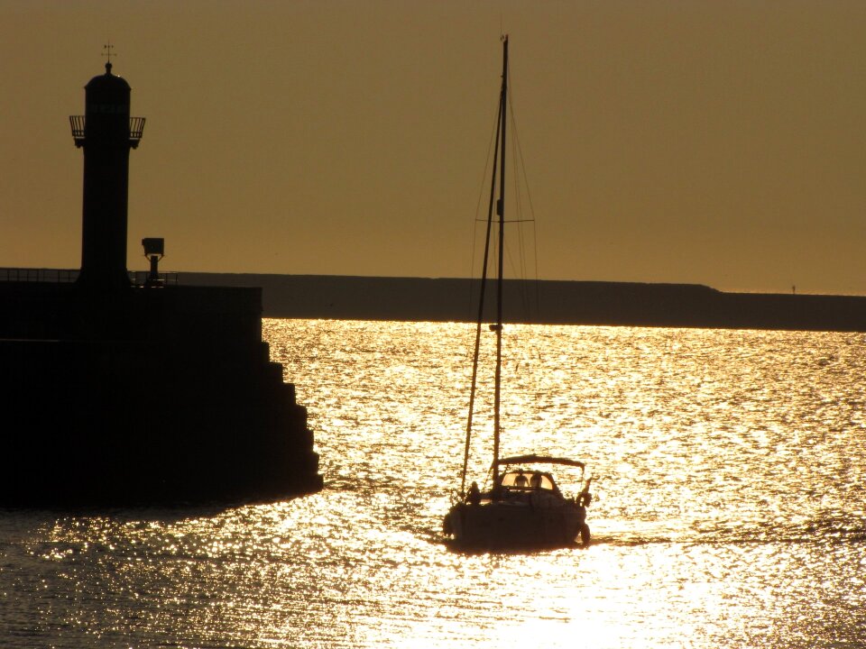 Lighthouse sunset sea