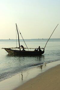 Fisherman boat ocean photo