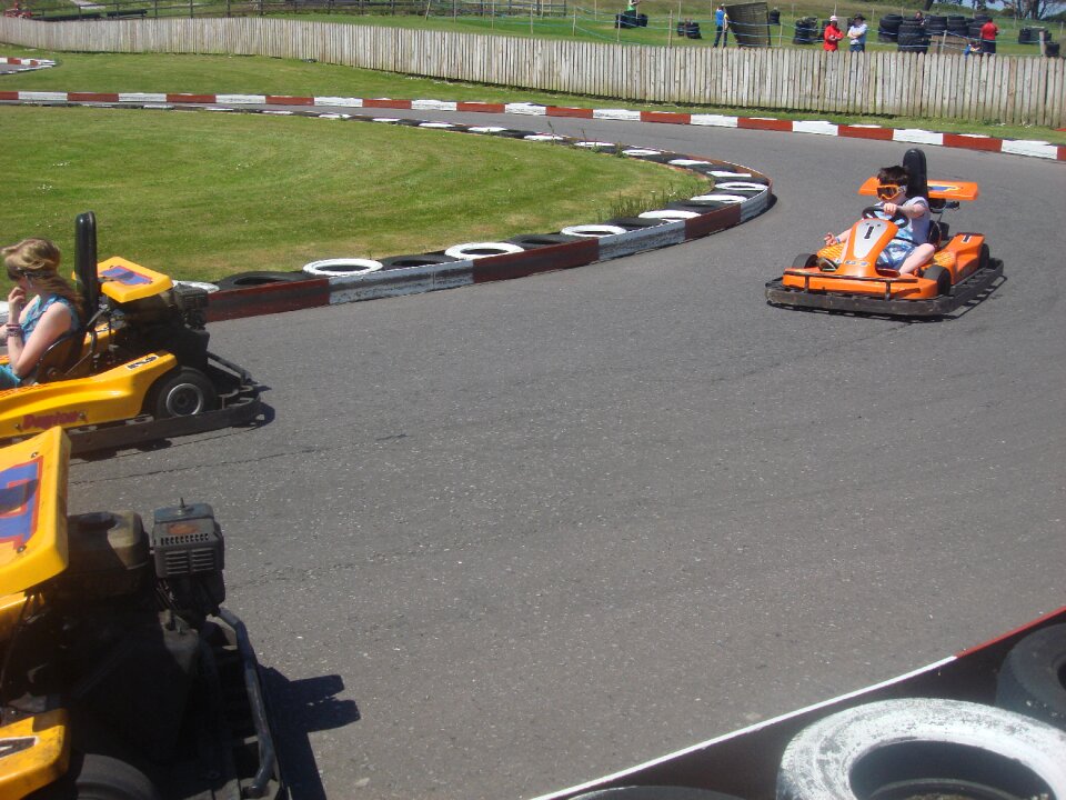 Children racing cars driving