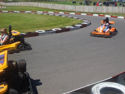 Children racing cars driving