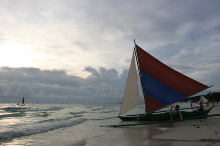 Sunset whet is the only boat republic of the philippines photo